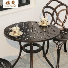 Bộ Bàn Ghế Nhôm Đúc Tròn 2 Ghế Hoa Văn Đan Lưới Màu Nâu Đồng - hình 1
