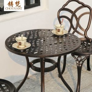 Bộ Bàn Ghế Nhôm Đúc Tròn 2 Ghế Hoa Văn Đan Lưới Màu Nâu Đồng - hình 1