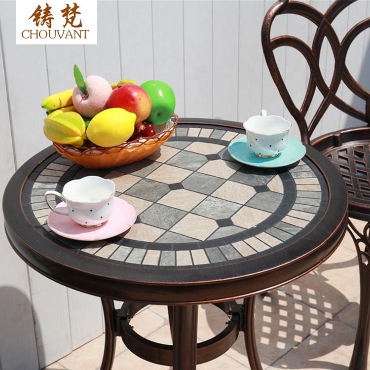 Bộ Bàn Ghế Nhôm Đúc Tròn 2 Ghế Hoa Văn Đan Lưới Màu Nâu Đồng Bộ Bàn Ghế Nhôm Đúc Tròn 2 Ghế Hoa Văn Đan Lưới Màu Nâu Đồng - hình 3