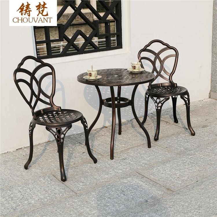 Bộ Bàn Ghế Nhôm Đúc Tròn 2 Ghế Hoa Văn Đan Lưới Màu Nâu Đồng Bộ Bàn Ghế Nhôm Đúc Tròn 2 Ghế Hoa Văn Đan Lưới Màu Nâu Đồng - hình 4